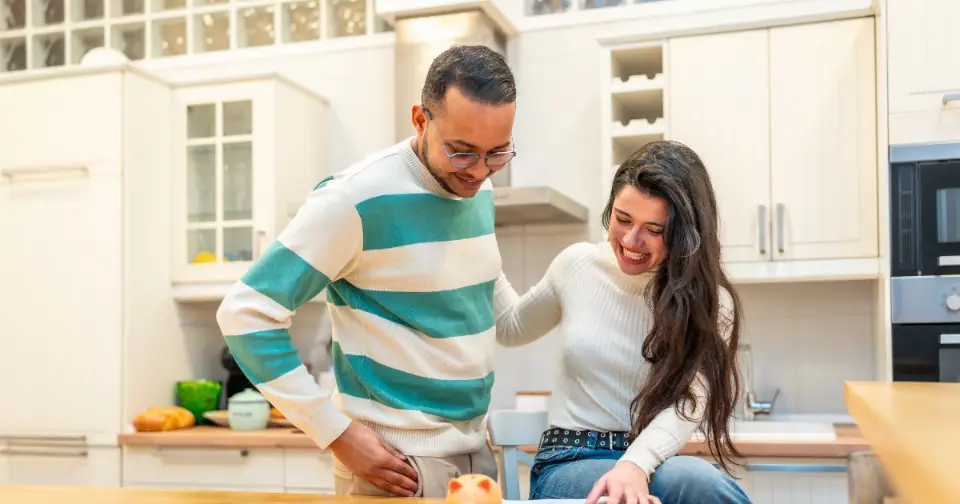 Home buyers planning mortgage repayments and household expenses before purchasing property