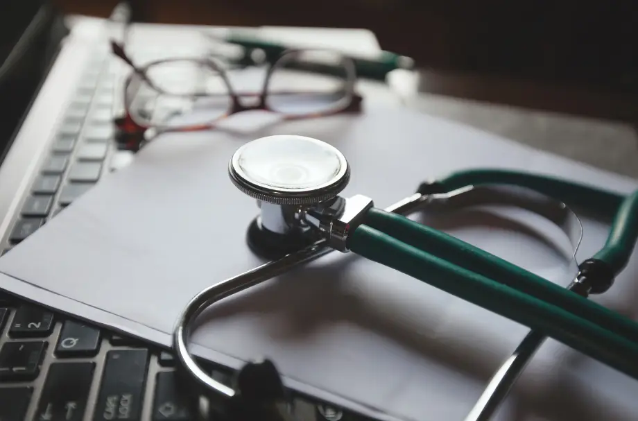 Stethoscope on a laptop representing doctor income and home loan assessment