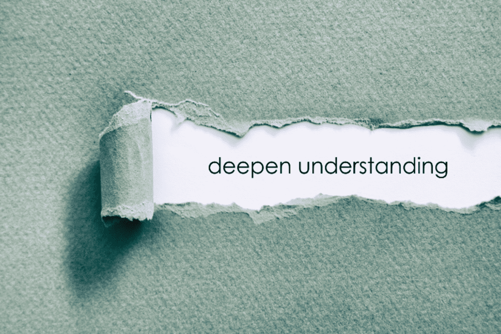 Torn paper revealing the words "deepen understanding