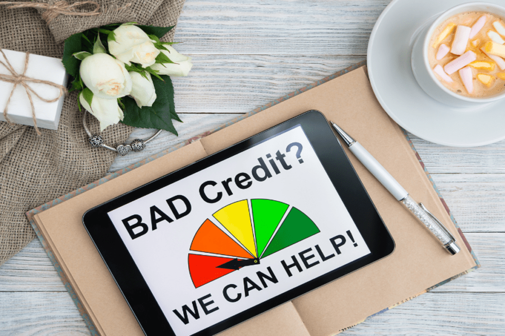 Tablet screen showing "Bad Credit? We Can Help!" with a credit score gauge, symbolising car loan options for bad credit borrowers.