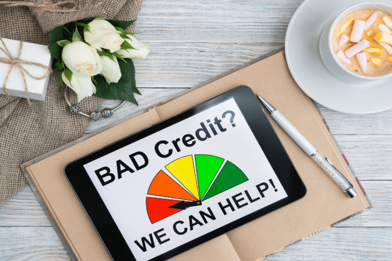 Tablet screen showing "Bad Credit? We Can Help!" with a credit score gauge, symbolising car loan options for bad credit borrowers.