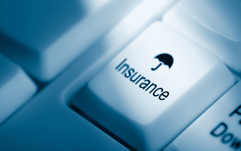 White keyboard key labeled “Insurance” with umbrella icon symbolising insurance protection.