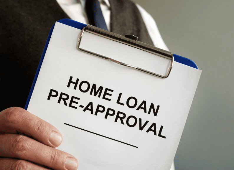 Close-up of a clipboard with the words “Home Loan Pre-Approval.”