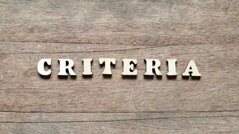 Wooden letters spelling “criteria” on rustic wood