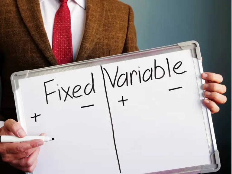 Person holding whiteboard comparing fixed vs variable