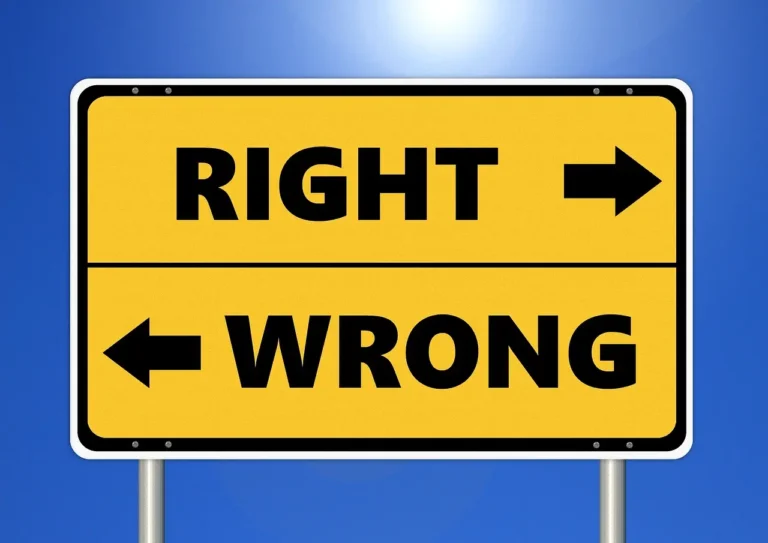 Yellow road sign showing “Right” with an arrow and “Wrong” with an arrow.