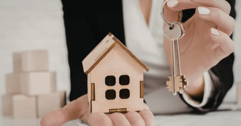 First home buyer receiving house keys after securing home loan approval